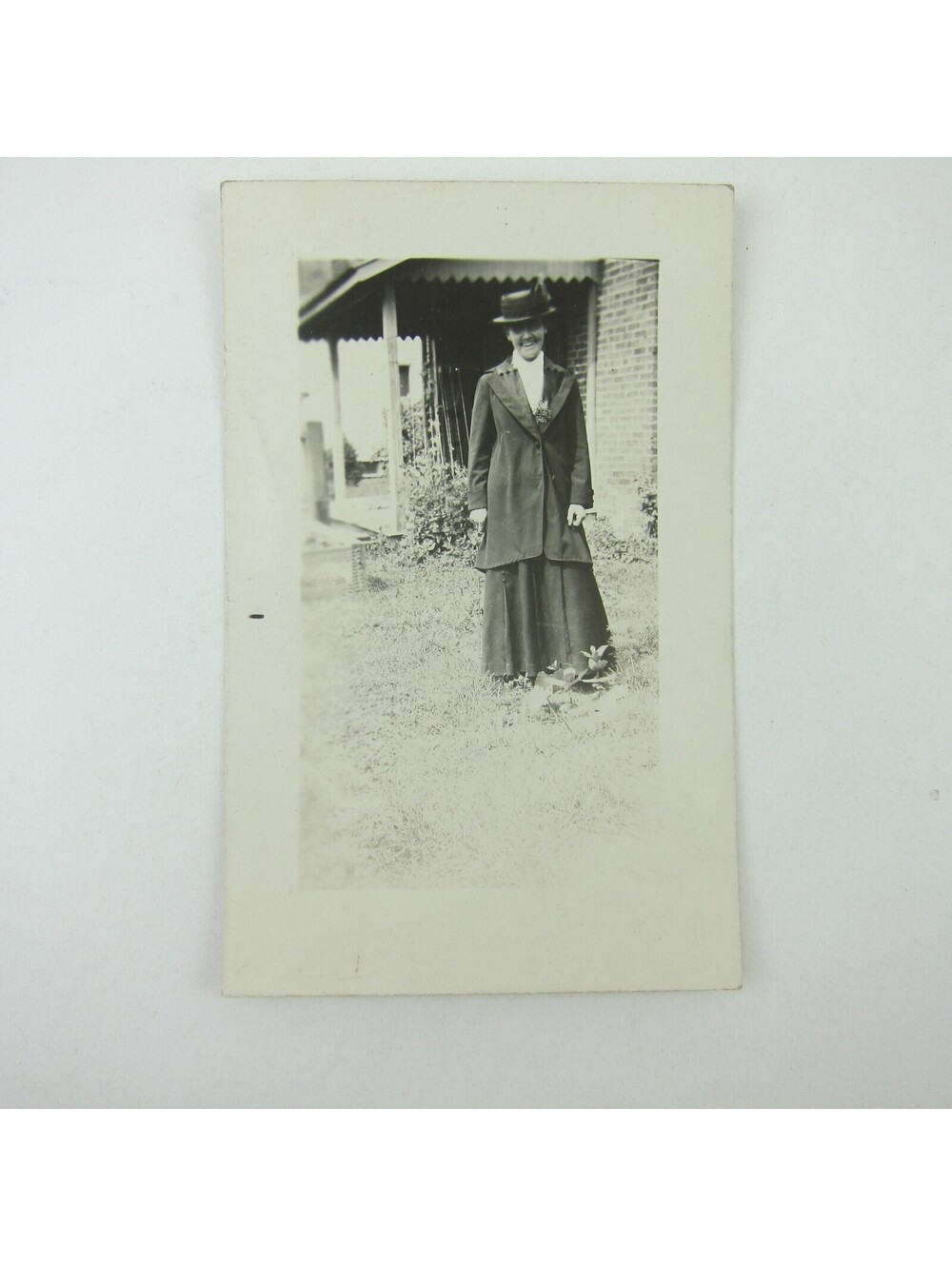 RPPC Photo Postcard Woman in Suit Dress & Hat Stands Outside House Antique 1910s